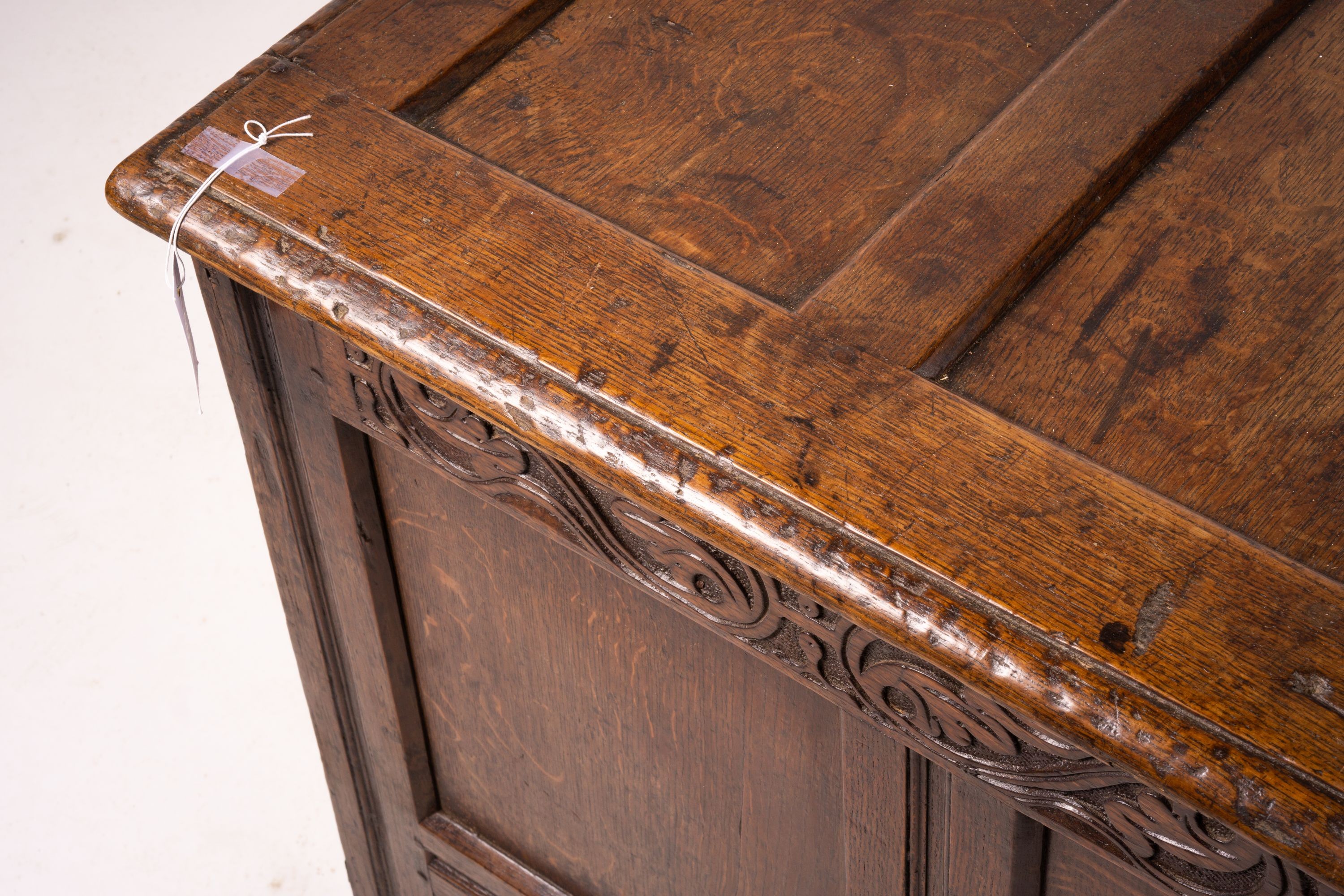 A 17th century panelled oak coffer, W.122cm D.55cm H.65cm